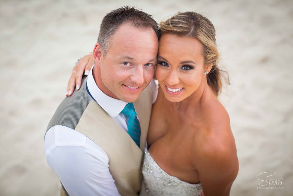 Couple smiling at the camera in Mexico 