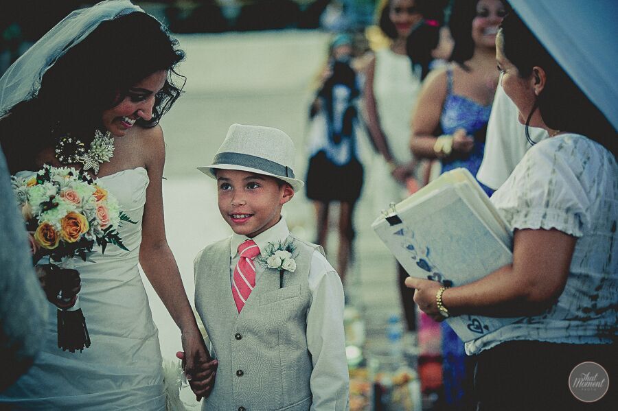 This hat and colourful tie really makes the look for this handsome ring bearer. ring bearer with hat and tie in ceremony