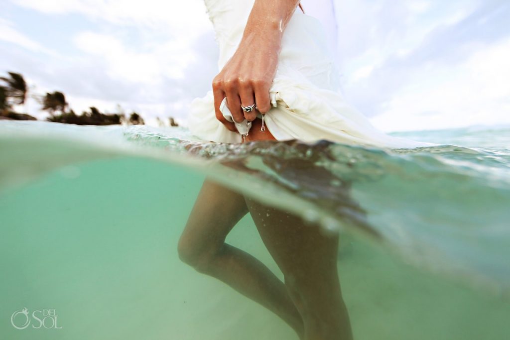 An ordinary moment creates and extraordinary photograph. 7 bride in the water on trash the dress