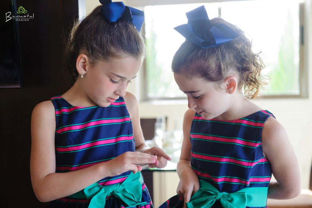 Flower girls getting ready for wedding 