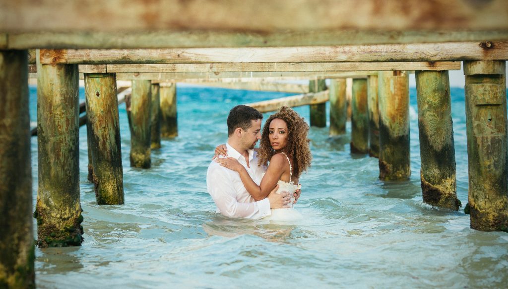  wedding couple in the peer for a picture 