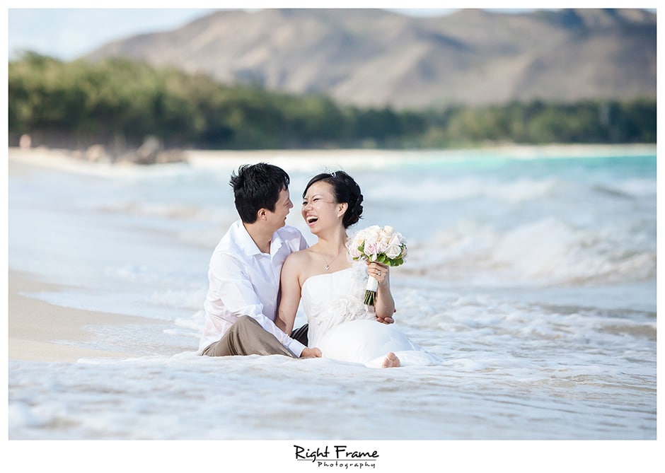  couple on the beach after their wedding 