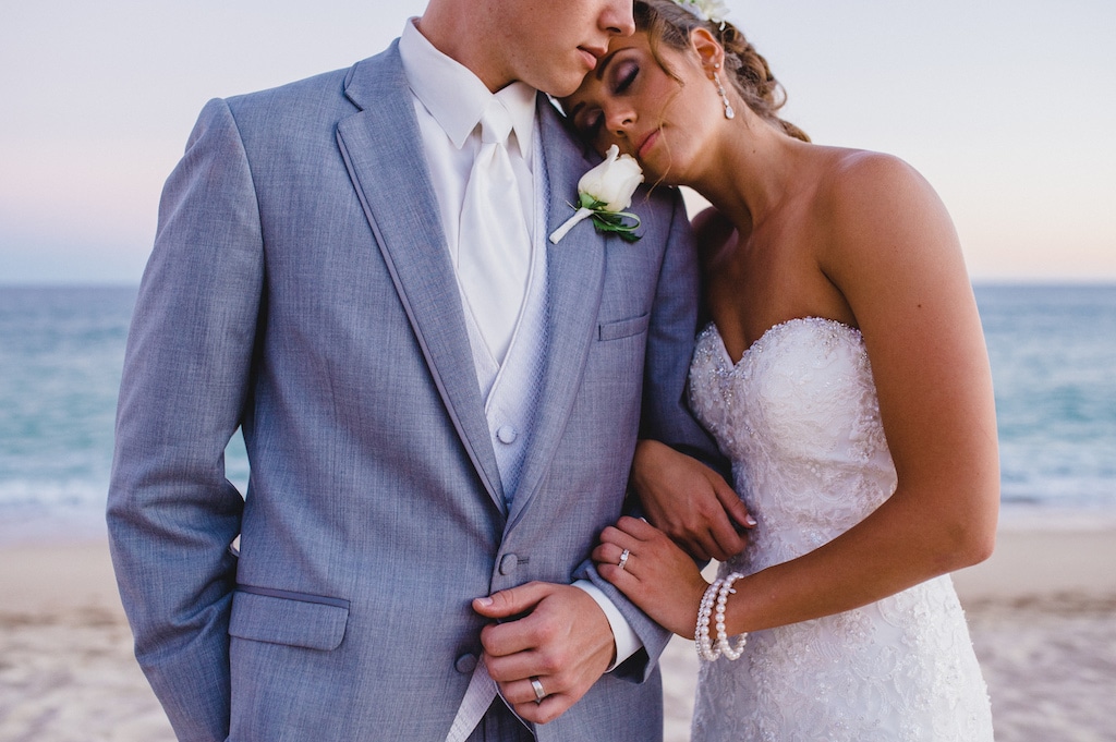 Couple standing together on the beach 