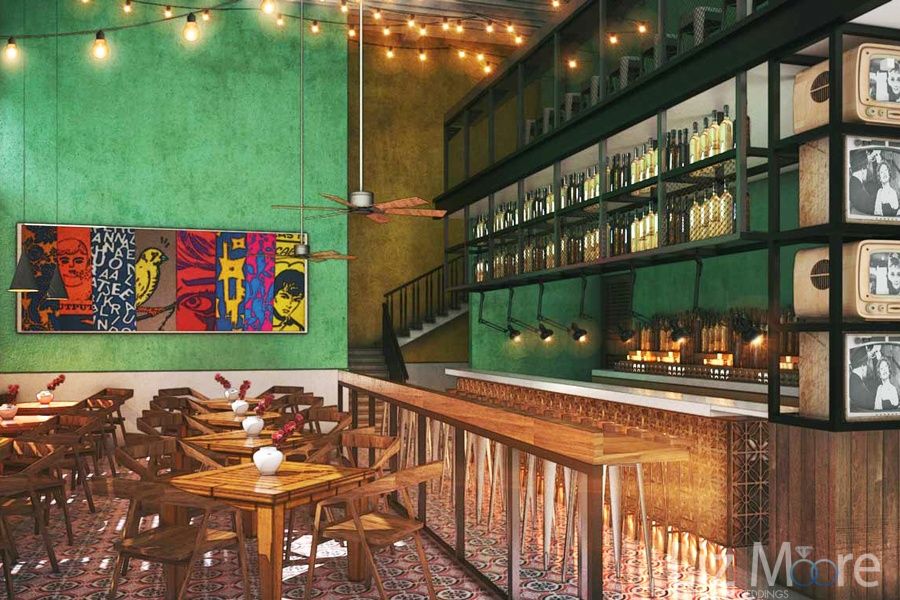 Resort area restaurant with a beautiful wood chairs green walls colorful artwork and premium drinks on the wall