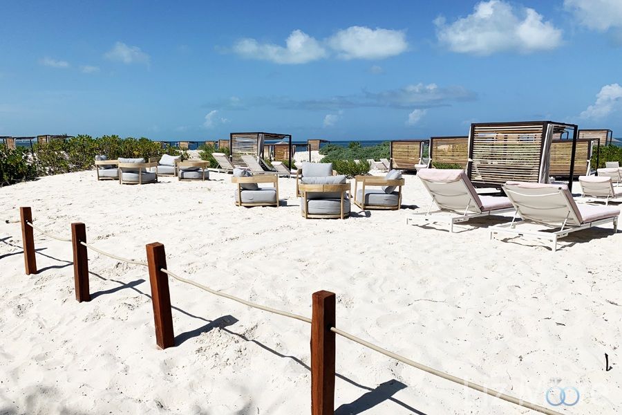 lounge chairs at the white sand beach