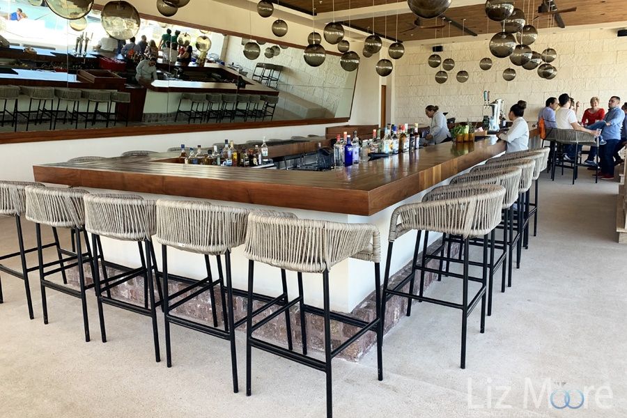 upper deck bar With return long stools and Mirror in back of bar