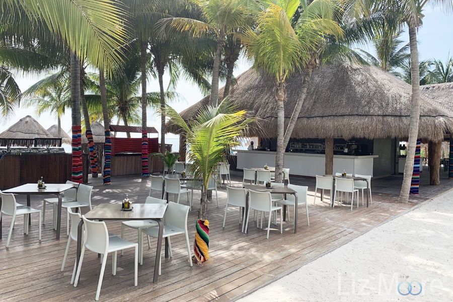 Main  beach restaurant With wood planks Sand And beautiful green palm trees