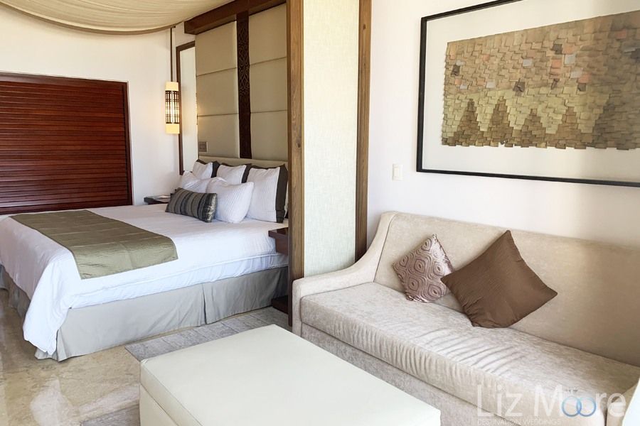 oceanview bedroom suite With a beautiful beige Valour couch