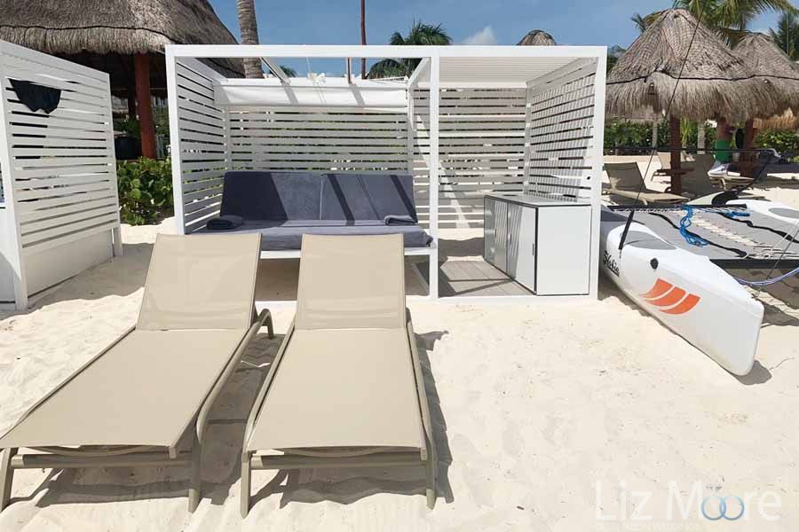 Outdoor large beach cabana us with extra table for drinks and Brown beach chairs