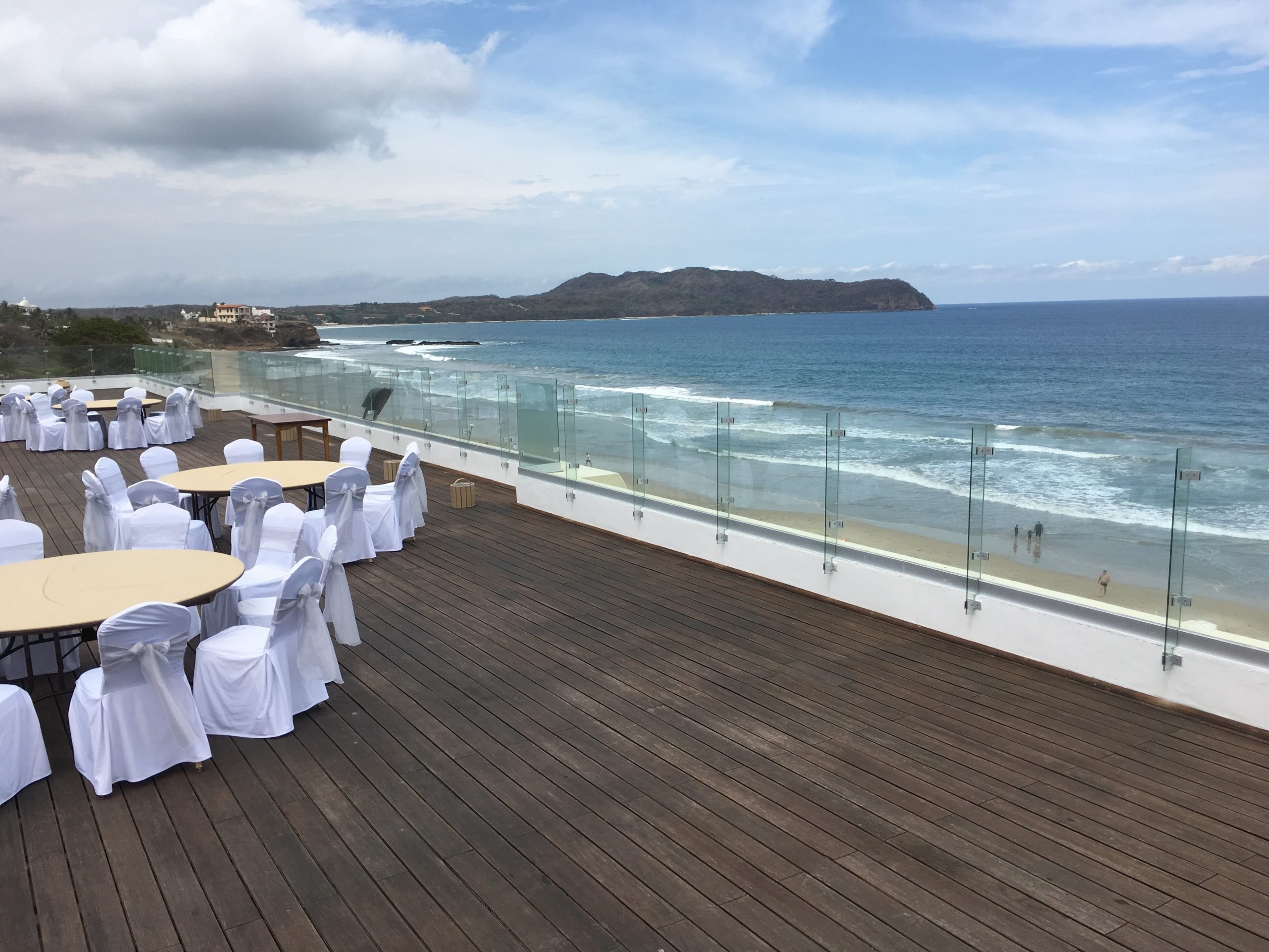 main would large deck with ocean front of use and reception table set up