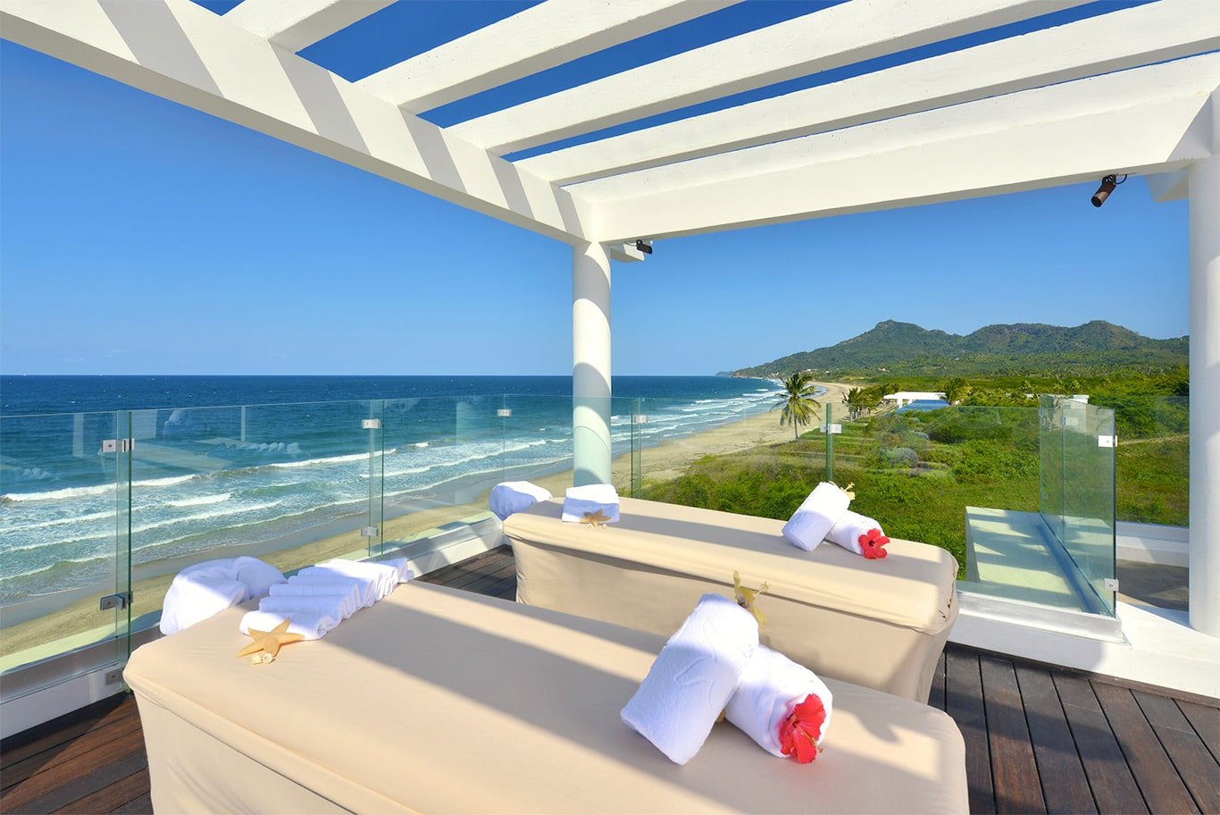 couples massage table set up on the ocean front deck overlooking the ocean
